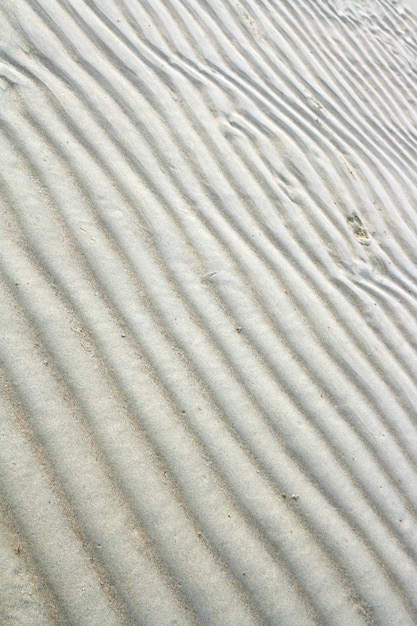 Padrão de fundo de ondulação da praia de areia, vertical