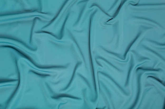 Padrão de fundo de textura Textura de tecido de seda verde Lindo tecido de seda macio verde esmeralda