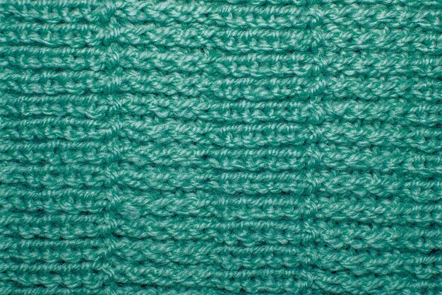 Padrão de malha de lã tricotada à mão. fundo de tecido de close up