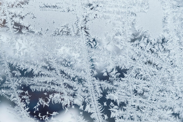 Padrões de gelo em vidro congelado Padrão de gelo abstrato em vidro de inverno como imagem de fundo