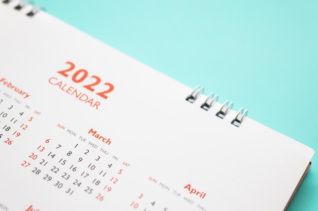 página de calendario 2022 sobre fondo azul concepto de reunión de cita de planificación empresarial