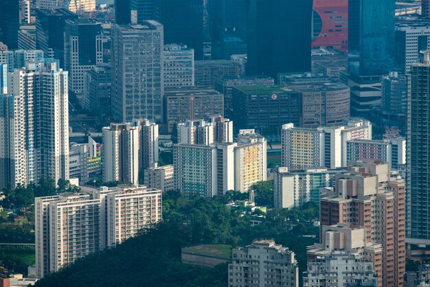 Paisaje de la ciudad del puerto de Victoria de Hong Kong, centro de negocios urbano con la torre del edificio del horizonte, escena del distrito de Asia de vista de la arquitectura de rascacielos para viajar