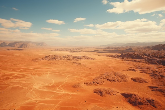 Paisaje desértico con arena roja y cielo azul.