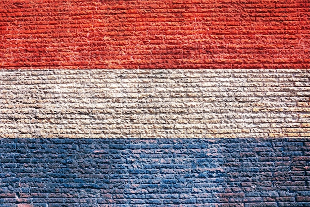 Países Bajos bandera holandesa pintada sobre una textura de fondo walll
