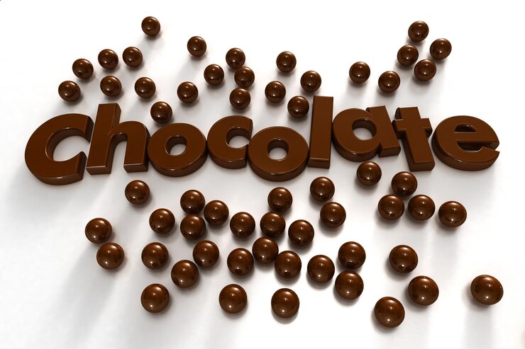 Foto palabra chocolate rodeado de gotas de chocolate sobre un fondo blanco.