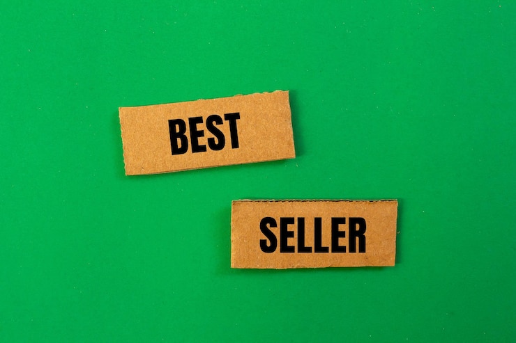 Foto palavras de best-seller escritas em papel rasgado com fundo verde símbolo de negócios conceitual