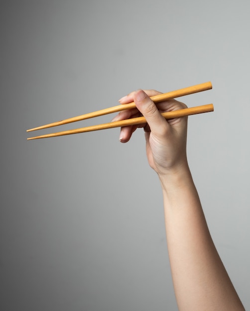 Palillo de mano asiático japonés comida china estilo tradicional