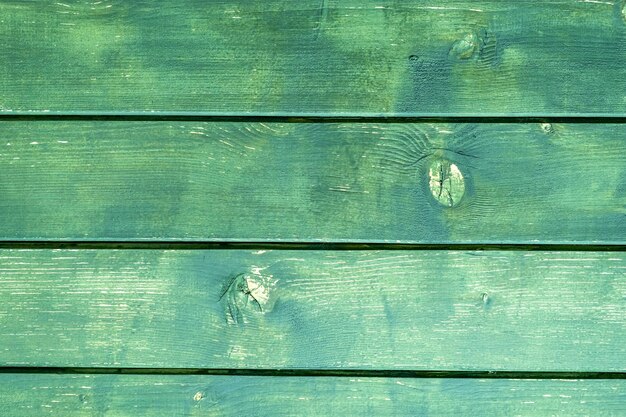 Un panel de madera verde con las palabras madera.