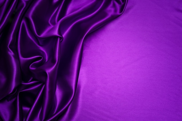 Paño púrpura abstracto de la pañería, fondo violeta oscuro de la tela