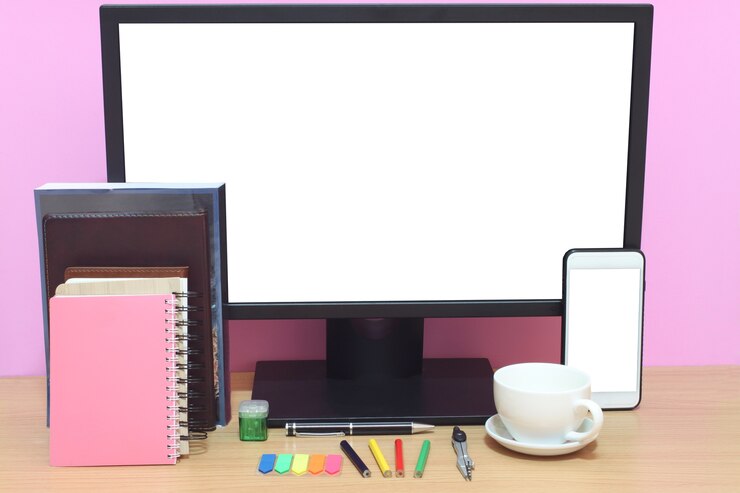 Foto la pantalla en blanco del portátil y los libros se colocan en el escritorio.