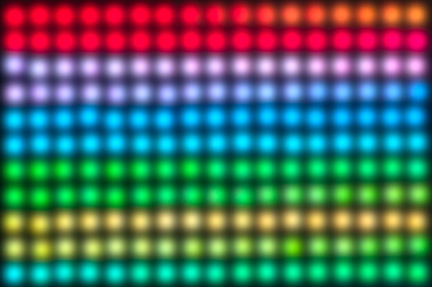Una pantalla de luces coloridas con muchos colores diferentes las luces están dispuestas en un patrón de cuadrícula los colores son brillantes y vibrantes creando una atmósfera animada y enérgica