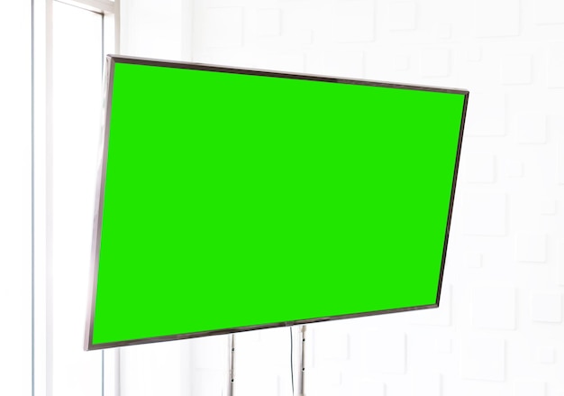 Foto pantalla de tv en blanco con clave de croma verde para maqueta y plantilla de pantalla de visualización