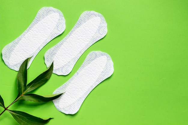 Panty liner de higiene femenina para la menstruación Almohadilla del ciclo menstrual fondo verde