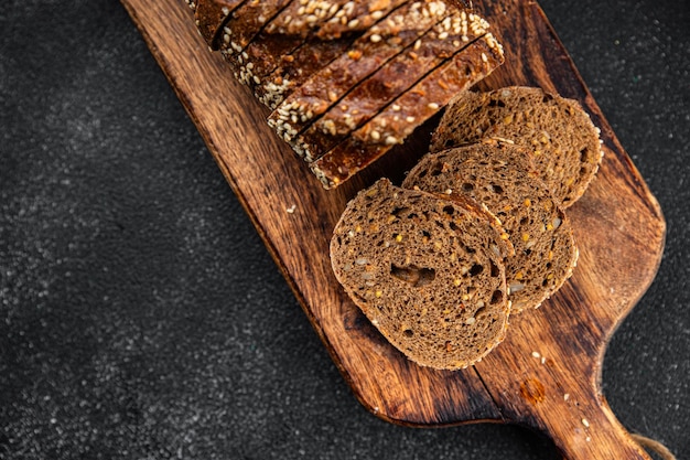 Foto pão de centeio fatias de sementes de girassol assados frescos alimentos saudáveis comer cozinha fresca refeição aperitivo