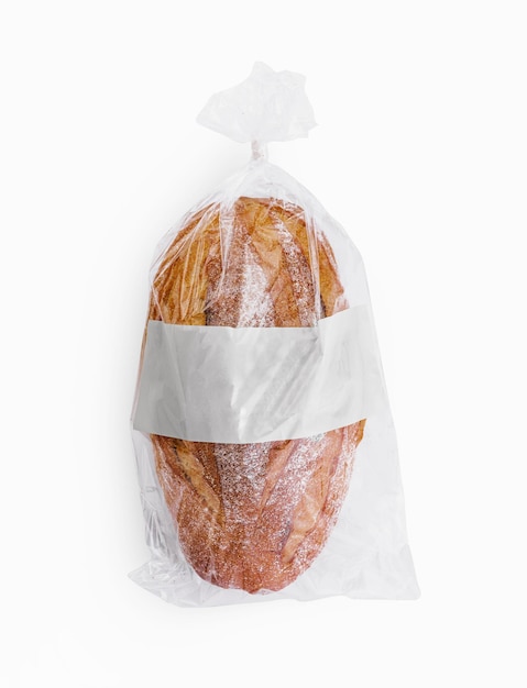 Foto pão recém-cozido num saco de plástico