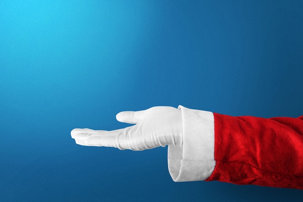 Foto papá noel con un gesto de la mano abierta