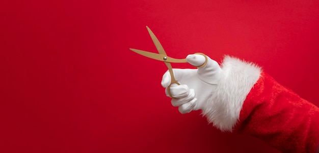 Papá Noel con tijeras de oro fondo festivo de gran inauguración