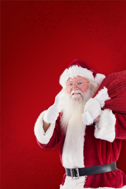 Papai Noel gosta de carregar seu saco contra o fundo vermelho