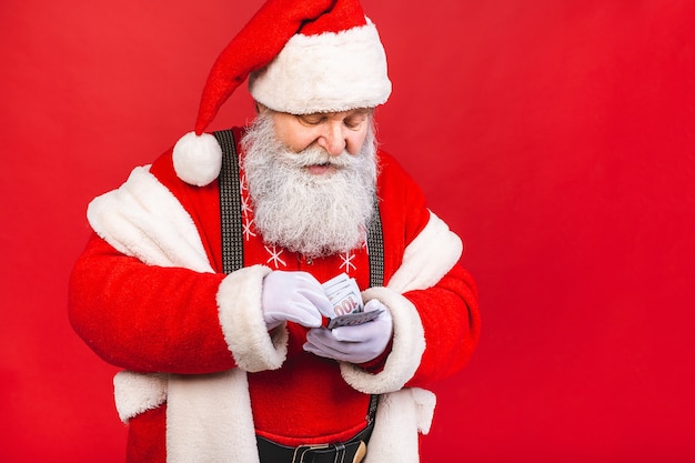 Papai noel segurando dinheiro