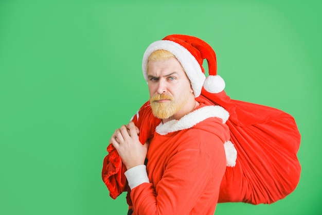 Papai Noel segurando uma sacola de presentes Papai Noel com presentes de ano novo Feliz Natal Papai Noel