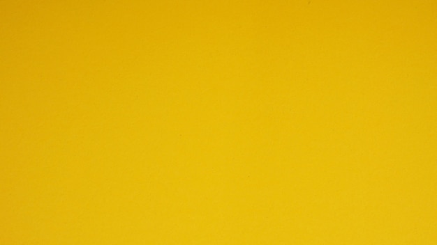 Papel amarelo para background.it é um espaço vazio e sem pessoas.