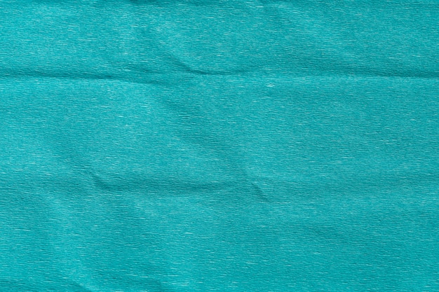 Foto papel arrugado arrugado azul abstracto de la textura para el fondo.