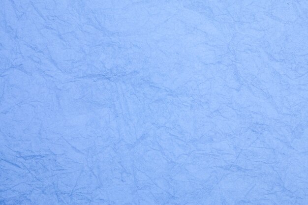 Papel azul vintage amassado com textura de fundo obsoleto.