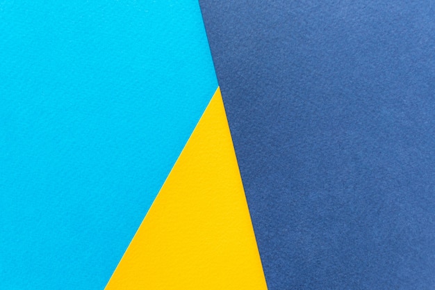 Papel de textura amarelo e azul.