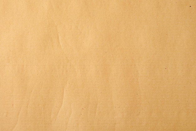 Papel kraft beige amarillo con salpicaduras de fondo para el diseño