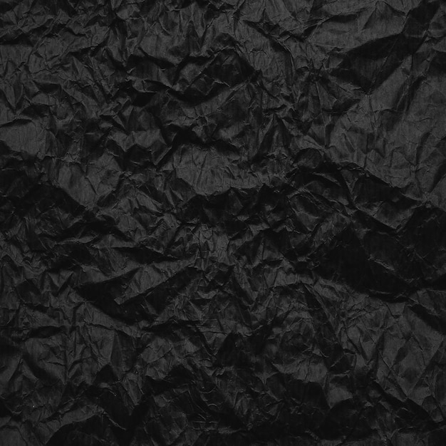 Papel kraft preto amassado Textura de papel reciclado preto amassado