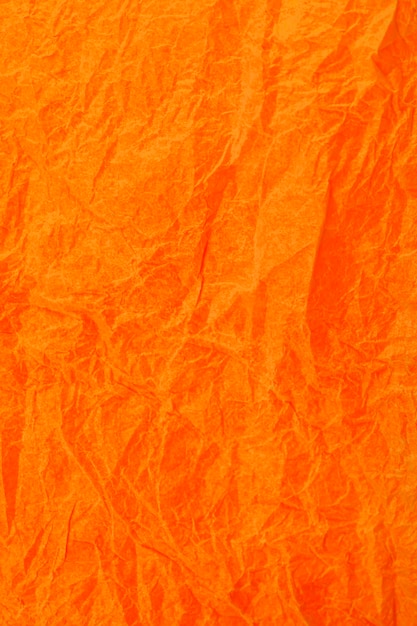 Papel laranja vintage amarrotado com textura de fundo obsoleto.