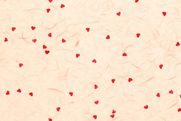 Papel de morera con fondo de san valentín de corazones rojos