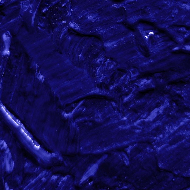 Papel tapiz de fondo texturizado en arte abstracto de pintura azul oscuro