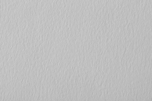 Papel texturizado gris cálido en blanco con partículas para designuse
