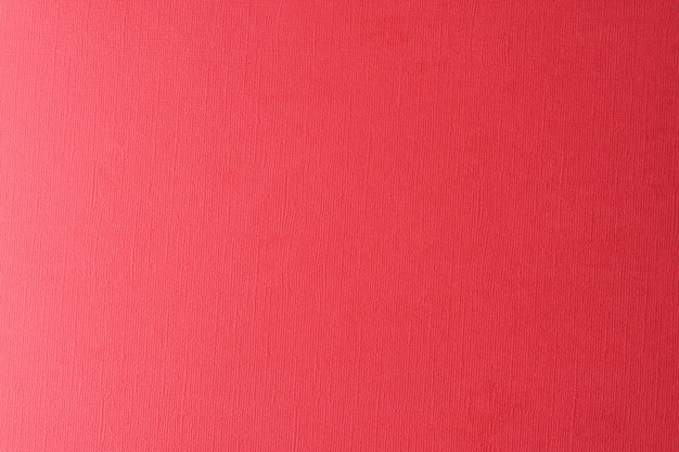 Papel vermelho fundo textured, fim acima.