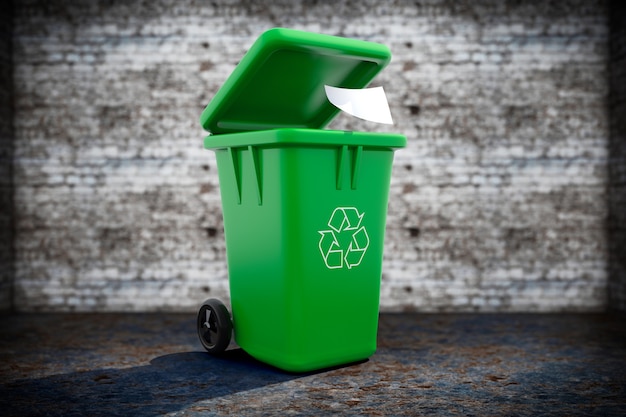 Foto papelera de basura verde sobre un fondo grunge