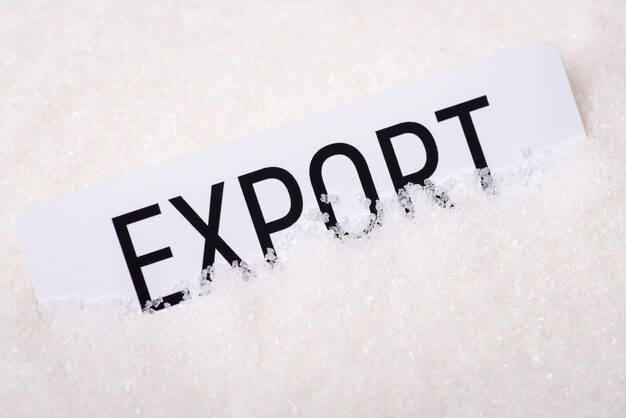 Papier mit der Aufschrift Export auf Kristallzucker