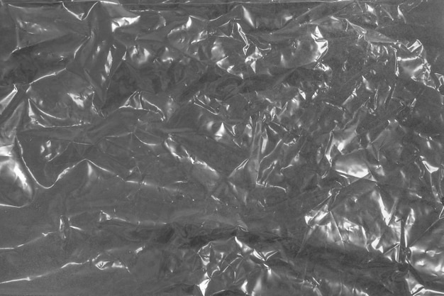 Papierhintergrund aus Aluminiumfolie Fototextur eines zufällig zerknitterten Aluminiumfolienblatts
