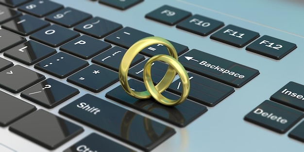 Par de anillos de boda dorados aislados en la ilustración 3d del teclado del ordenador portátil