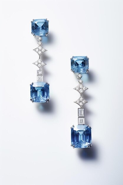 Foto un par de pendientes de diamantes azules y blancos