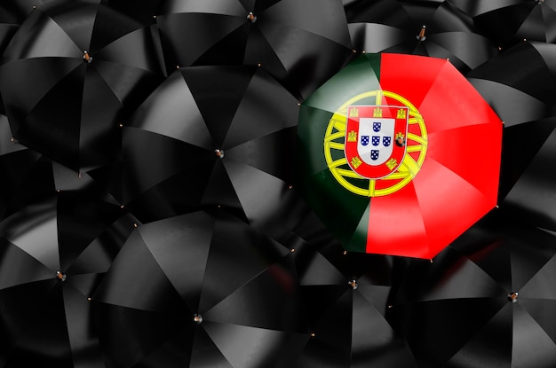 Paraguas con bandera portuguesa entre sombrillas negras 3D rendering