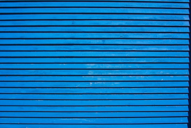 Pared azul de tablas delgadas de fondo o textura