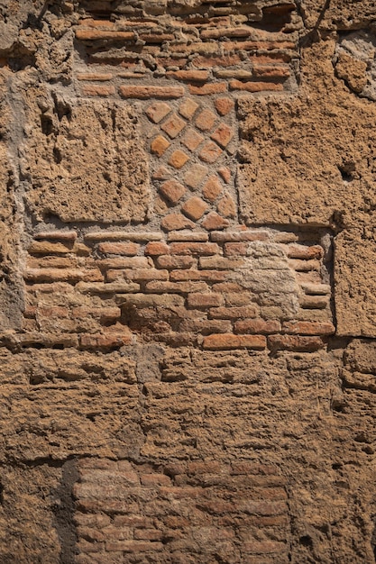 Foto pared de una casa en la antigua ciudad de pompeya ladrillo antiguo valor histórico italia antigua