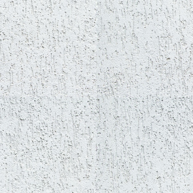 Pared de cemento blanco de patrones sin fisuras de fondo abstracto