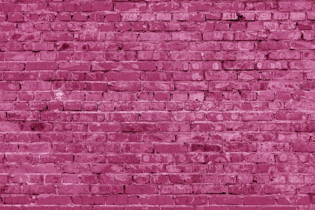 Pared del edificio de ladrillo rosa. Interior de un loft moderno. Fondo para el diseño