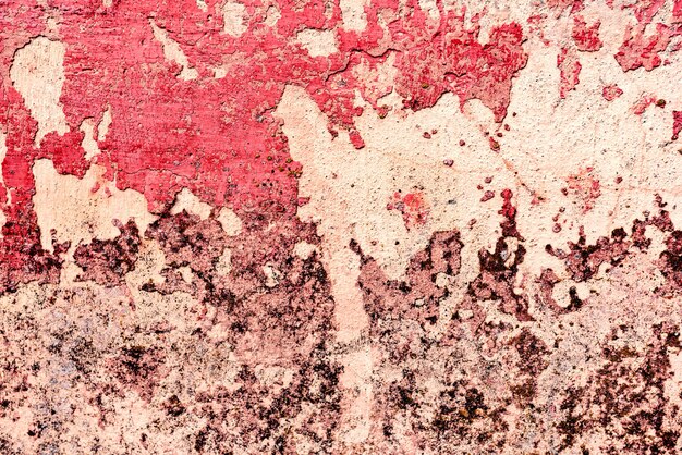 Foto pared de fondo con masilla pintada superficie de textura rosa