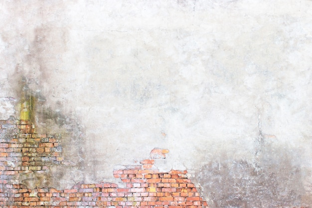 Foto pared gris con escayola y ladrillos