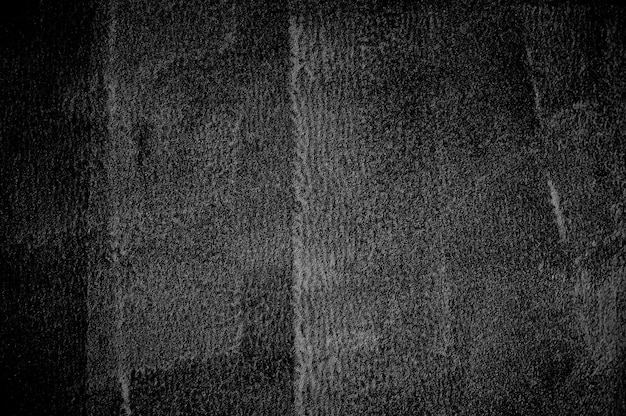 Pared de hormigón negro grunge con fondo claro