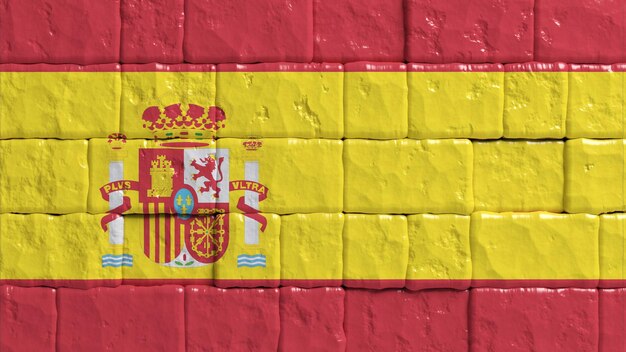 Foto pared de ladrillo con bandera pintada de españa