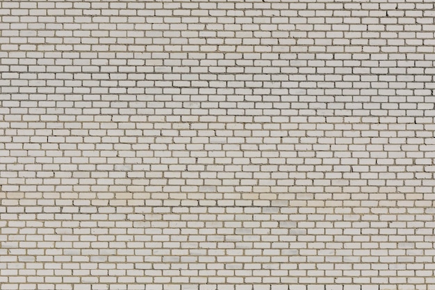 Pared de ladrillo blanco del edificio moderno para el fondo